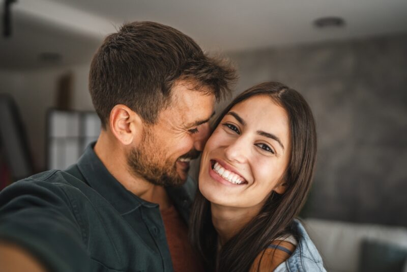 Happy couple in an article on 2025 new years resolutions for couples committed to their relationship.