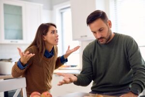 Couple arguing in an article by Stefanie Kuhns on how constant bickering erodes the intimacy in a marriage.